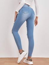 High Waisted Ripped Raw Hem Skinny Jeans